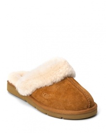 You will never want to take off these cozy, warm slippers with shearling lining and cuff from UGG® Australia. 1 rubber wedge and durable rubber sole.