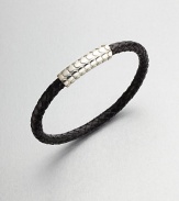 A simple design with modern sensibilities defines this woven leather bracelet, accented by a sterling silver clasp.LeatherSterling silverAbout 3 diam.Made in the United Kingdom