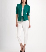 Short and sweet, but also sophisticated, this versatile sweater of cotton and silk has a peplum-like shape and rich ribbed textures.Ribbed band necklineShoulder detailingElbow-length sleeves with ribbed detail and cuffsPatterned ribbed backSeamed waist with ribbon tiesAbout 22¾ from shoulder to hem70% cotton/30% silkDry cleanImported Model shown is 5'9½ (176cm) wearing US size Small. 