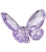 Dazzling in the wings. This bejeweled butterfly reflects the light beautifully with faceted violet wings edged in glittering crystal dots. A special figurine from Swarovksi.