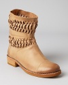 Charming woven details and neutral-hued leather take Modern Vintage's Orsa boot to must-have levels--you'll find yourself pairing them with anything and everything.