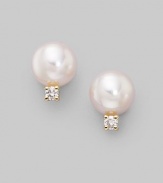 From the Akoya Collection. Classic white cultured pearl studs with sparkling diamond accents, set in 18k gold. 6mm white round cultured pearls Quality: A+ Diamonds, 0.06 tcw 18k yellow gold Post back Imported