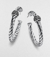 Striking cables of sterling silver, wrapped in rhodium-finished bands set with glittering pavé diamonds. Diamonds, 0.25 tcw Sterling silver Diameter, about 1½ Post back Made in USA