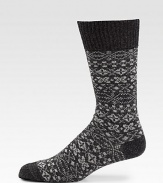 A timeless fair isle pattern adorns this wool-blend dress essential.Mid-calf height45% wool/33% polyamide/18% viscose/4% angoraMachine washImported