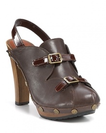 Glossy patent trim and scalloped accents lend ladylike appeal to these See by Chloé clogs. Glossy patent trim and scalloped accents lend ladylike appeal to these See by Chloé clogs.
