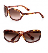 Refined plastic frames with floating lens and signature T logo temples. Available in light havana with brown gradient lens.Signature T logo temples100% UV protectionMade in Italy 