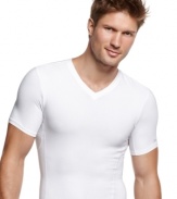 Comfortable enough to wear every day, this slimming compression t shirt from Calvin Klein visibly flattens your midsection for a sleek silhouette.