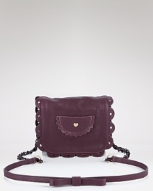 Tap into See by Chloé's whimsical brand of cool with the label's purple leather crossbody. With girlie ruffled detailing and a quirky-cute hue, this style adds a dose of off-beat chic. Tap into See by Chloé's whimsical brand of cool with the label's purple leather crossbody. With girlie ruffled detailing and a quirky-cute hue, this style adds a dose of off-beat chic.