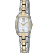 Luminous innovation in a timeless appearance, a solar-powered watch by Seiko. Crafted of stainless steel bracelet with gold-tone accents and rectangular case with gold-tone bezel. White dial features silver-tone applied stick indices, gold-tone Roman numerals at twelve and six o'clock, gold-tone two hands and logo at twelve o'clock. Solar-powered quartz movement. Water resistant to 50 meters. Three-year limited warranty.