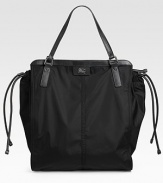 Lightweight packable nylon with adjustable leather drawstring fits beauty secrets, mags and more. Double top handles, 7½ drop Top zip closure Inside zip pocket Fully lined 14¼W X 16½H X 6½D Imported