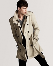 An undisputed classic from Burberry, the double-breasted trench coat brings understated style to blustery days. An undisputed classic from Burberry, the double-breasted trench coat brings understated style to blustery days.