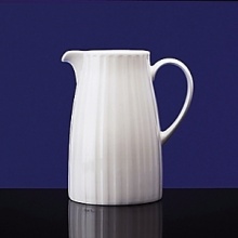 Simple shapes of crisp white are accented with precisely etched lines. Contrasting black matte jasper accessories with glazed interiors are also available. Bone china. Simple shapes of crisp white are accented with precisely etched lines. Contrasting black matte jasper accessories with glazed interiors are also available. Bone china.
