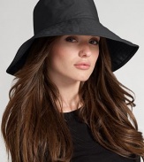 Floppy, water-resistant coated cotton is stylish for rainy days. Signature logo detail Brim, about 4¼ wide One size fits most Cotton; spot clean Imported