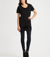 Simply chic scoopneck with a twisted cutout design and hi-low hem. Scoopneck Short sleeves Twisted cutouts at hem Hi-low hem About 21 from natural waist 40% wool/28% viscose/15% polyester/10% cashmere/7% angora Dry clean Imported of Italian fabric