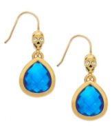 Bone up on fierce fashion with these teardrop earrings from Juicy Couture. A clear glass-accented skull tops a faceted blue glass teardrop. Crafted in 14k gold-plated mixed metal. Approximate drop: 1-1/4 inches.