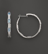 Faceted Swiss blue topaz and white sapphires, set in sterling silver, evoke art deco style. By Elizabeth Showers.