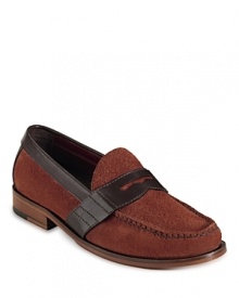 Cole Haan's handsewn penny loafer is crafted in supple suede, with Nike Air™ technology in the heel for superior support. Cole Haan's handsewn penny loafer is crafted in supple suede, with Nike Air™ technology in the heel for superior support.