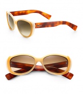 Flashback to the 50's with these small cat's-eye sunglasses in lightweight acetate with logo temples. Available in havana with brown gradient lens or beige with gray lens.Plastic logo temples100% UV protectionMade in Italy