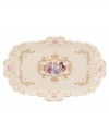 Accent your bedroom or bath with a vanity tray fit for a princess. Cinderella's pumpkin coach adorns ivory porcelain with gold swirls, twinkling stars and pretty pink hearts. A scalloped edge and raised beading refine the ultra-feminine Disney piece. Qualifies for Rebate