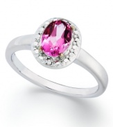 Pink perfection. Victoria Townsend's pretty ring features an oval-cut pink topaz (1-1/10 ct. t.w.) surrounded by diamond accents. Set in sterling silver. Size 7.