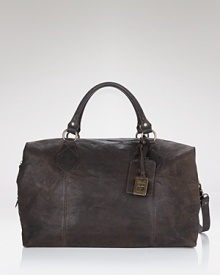Rugged style for short trips. This weathered leather overnight bag has a top handle, adjustable strap and plenty of interior compartments for your weekend away. Rugged style for short trips. This weathered leather overnight bag has a top handle, adjustable strap and plenty of interior compartments for your weekend away.