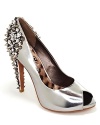 Sweet peeptoe in the front, punky spikes in the back. Coming or going, Sam Edelman's metallic pumps make an impression.