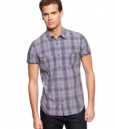 Get to work on great style by rolling up the sleeves with this plaid shirt from Calvin Klein.
