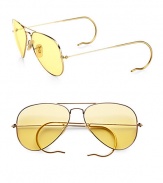 A sunny update to the classic aviator style, crafted in sleek, sophisticated metal with round temple tips. Available in gold with ambermatic lens.Metal temples100% UV protectionMade in Italy