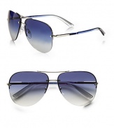 Favorite aviator design in a modern rimless style with logo engraved detail. Available in silver with blue gradient lens and brown demi shiny with brown gradient lens.UV400 lensTubular templeMade in Italy