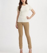 A smooth stretch style with seamed details. Button closure Zip fly Belt loops Wide band hem Inseam, about 32 50% nylon/46% viscose/4% elastane Dry clean Imported 