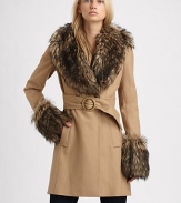 A felted, wool-rich layer updated with luxurious faux fur accents and a belted waist for an ultra-feminine silhouette.Faux fur collarLong sleeves with faux fur cuffsPrincess seamsDouble-breasted button frontBuckle waist with back belt loopsSlash side pocketsBack ventAbout 34 from shoulder to hemFully linedBody: 65% wool/35% viscoseFaux fur trim: acrylicDry cleanImportedModel shown is 5'10 (177 cm) wearing US size 4. 