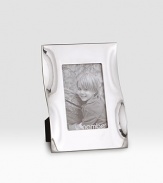 A striking accent crafted from polished alloy metal that takes on a natural look with flowing edges that delicately catch the light. Accommodates a 4 X 6 photograph Metal Imported 