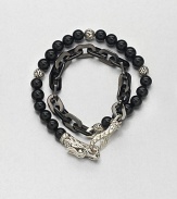 Double-strand beaded and link bracelet of sterling silver and black onyx is offset by an engraved lobster clasp.Sterling silver/stainless steelBlack onyxAbout 3 diam.Imported