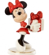 What a gift! A very beautiful Minnie Mouse delivers a sparkle-wrapped surprise for someone special in this magical Disney figurine by Lenox.