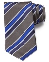 Not your average stripe design, this lavish silk tie is intricately detailed with deft variations on a classic width.