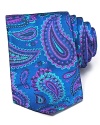 A bold paisley print in vivid hues adorns this DUCHAMP silk tie.