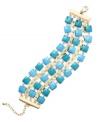 A tropical infusion. Charter Club's trendy bracelet will spice practically any look up with its three-row design and bright blue epoxy beads. Crafted in gold tone mixed metal. Approximate length: 7 inches + 2-inch extender.