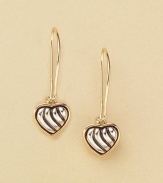 Pretty heart drop earrings dangle from sterling silver with 18kt gold accents. Imported