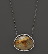 Diamonds circle a faceted rutilated quartz and smoky labradorite doublet set in blackened sterling silver. By Di Massima.