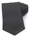 A luxurious piece that lies at the center of your dress wardrobe, this handsome tie from Salvatore Ferragamo is crafted in 100% Italian silk.