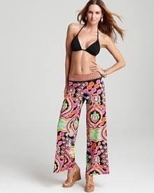 Trina Turk's exotic harem pants make poolside lounging feel extra luxurious. Pile on the accessories for an opulent swim ensemble.