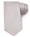 An opulent tie in lavish Italian silk features an allover diamond design in a classic width.