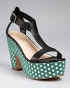 The ultimate statement-making shoe--Loeffler Randall presents a chunky sandal silhouette adorned with metallic polka dots and a uniquely shaped sole.