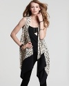 Navigate the urban jungle with ease in this DKNY sleeveless scarf blouse, embellished in an eye-catching animal print.