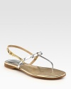 Skinny metallic leather straps in a two-tone design, enhanced by a rubber sole and adjustable slingback. Metallic leather upperLeather liningRubber solePadded insoleMade in Italy