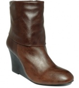 Stand tall for fall! A stacked wood wedge heel and a lace-up closure detail in back makes Style&co.'s Zanie round-toe booties  a must-have item this season.