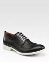 Sleek, smooth design of fine Italian leather with contrast sole.Leather upperLeather liningRubber soleMade in Italy