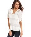 Sheer lace panels adds sultriness to this otherwise sweet BCBGMAXAZRIA blouse -- perfectly paired with denim!