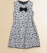 A ladylike frock with an elegant floral print and velvet bow at the chest. CrewneckBack concealed zip closureSleevelessA-line silhouette Fully linedVelvet-trimmed hemCottonDry cleanImported