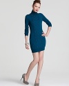 A wool DIANE von FURSTENBERG sweater dress features cable knit through the front for an effortlessly chic work-to-weekend look. Pair with neutral suede pumps for polish.